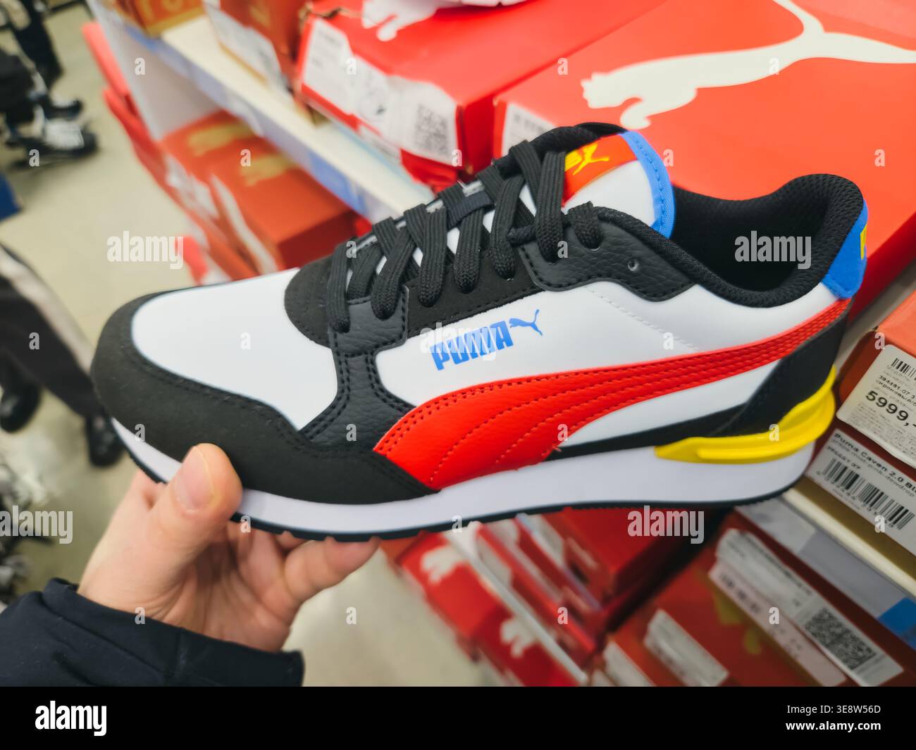Puma shop interior sneakers display hi-res stock photography and