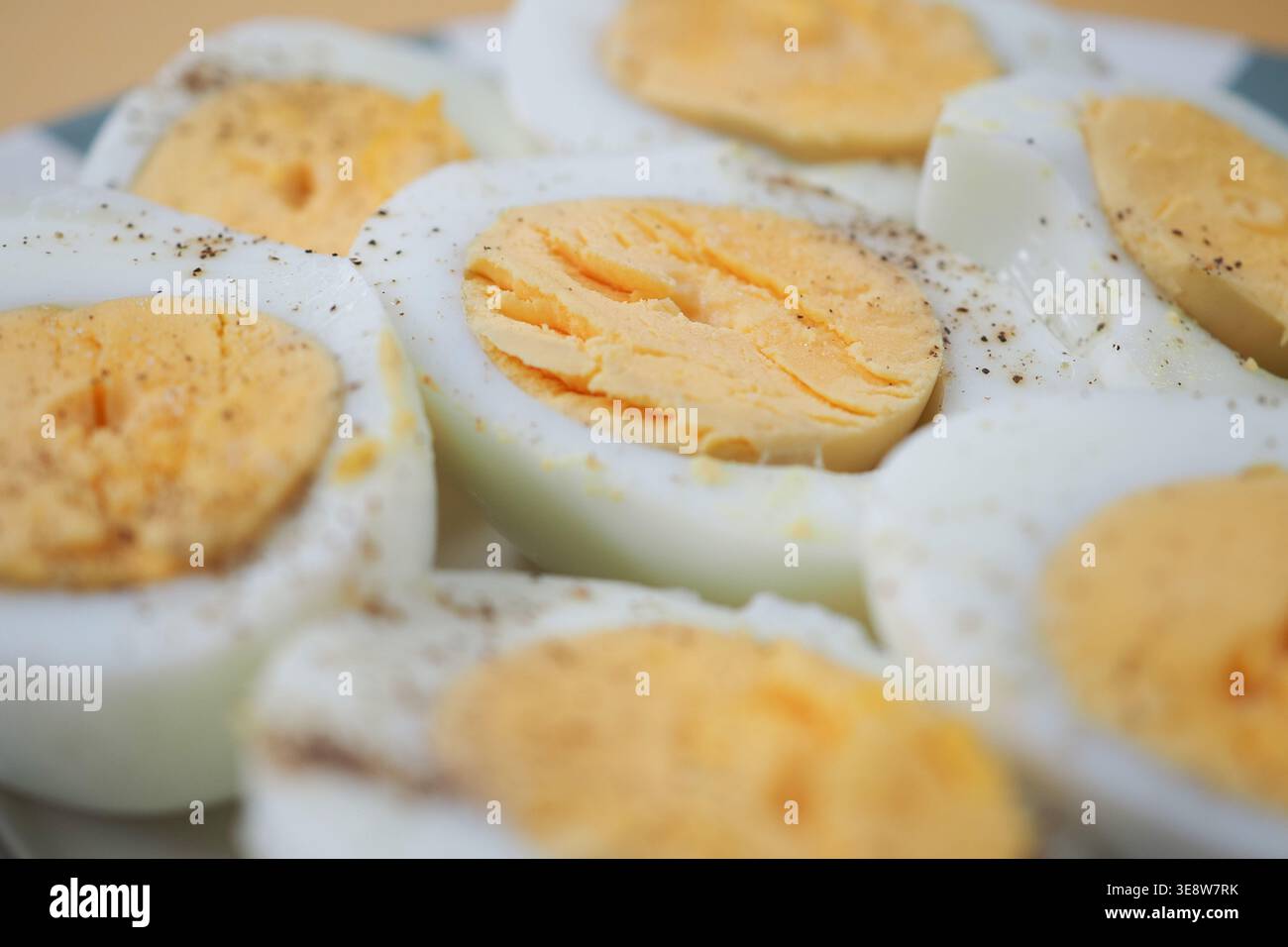 Eggs are cut in half on a plate Stock Photo