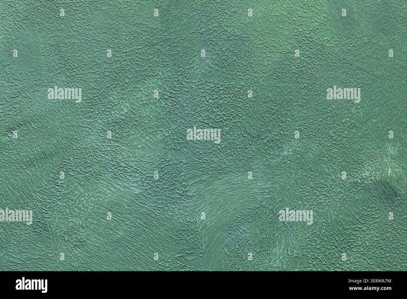 Textured turquoise painted wall surface with cracked weathered paint and rough pattern Stock Photo