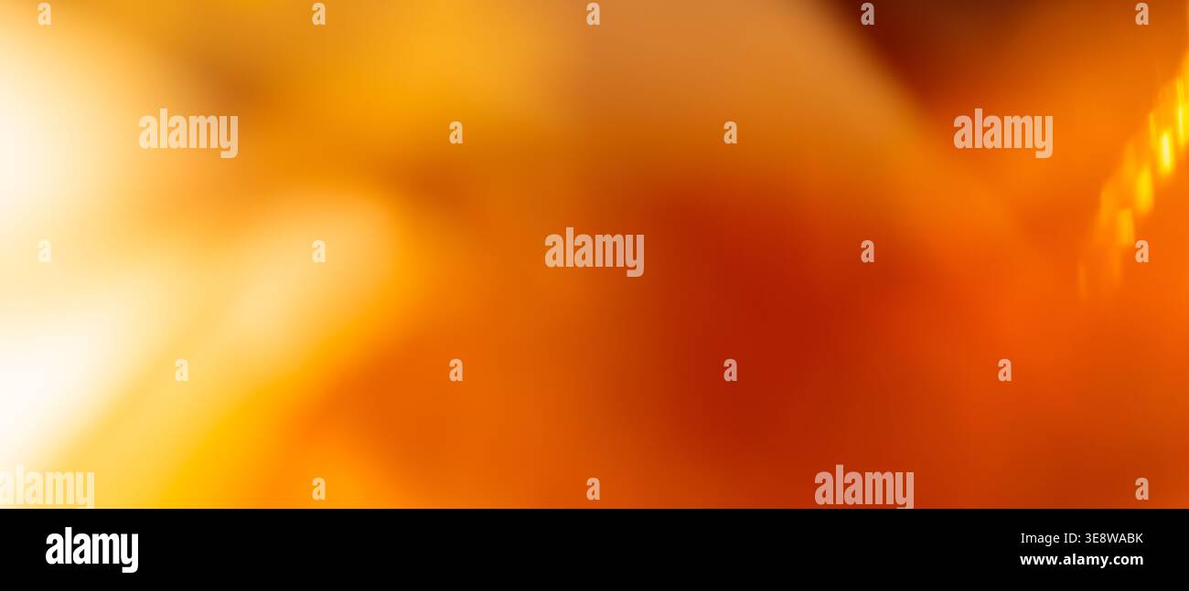 Warm golden orange abstract background with glowing light streak and dark red diagonal texture Stock Photo