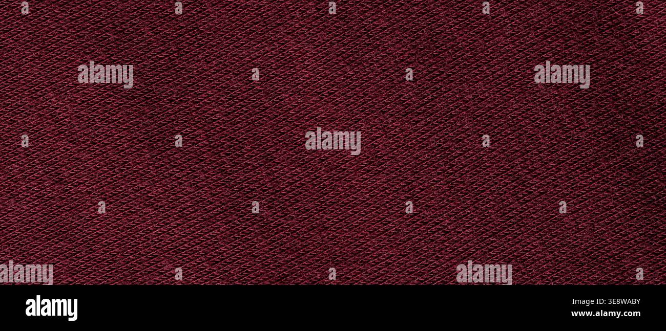 Dark burgundy woven fabric texture background with diagonal pattern close-up Stock Photo