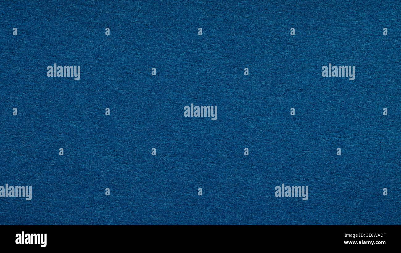 Dark blue paper texture background with subtle grain for design and copy space Stock Photo