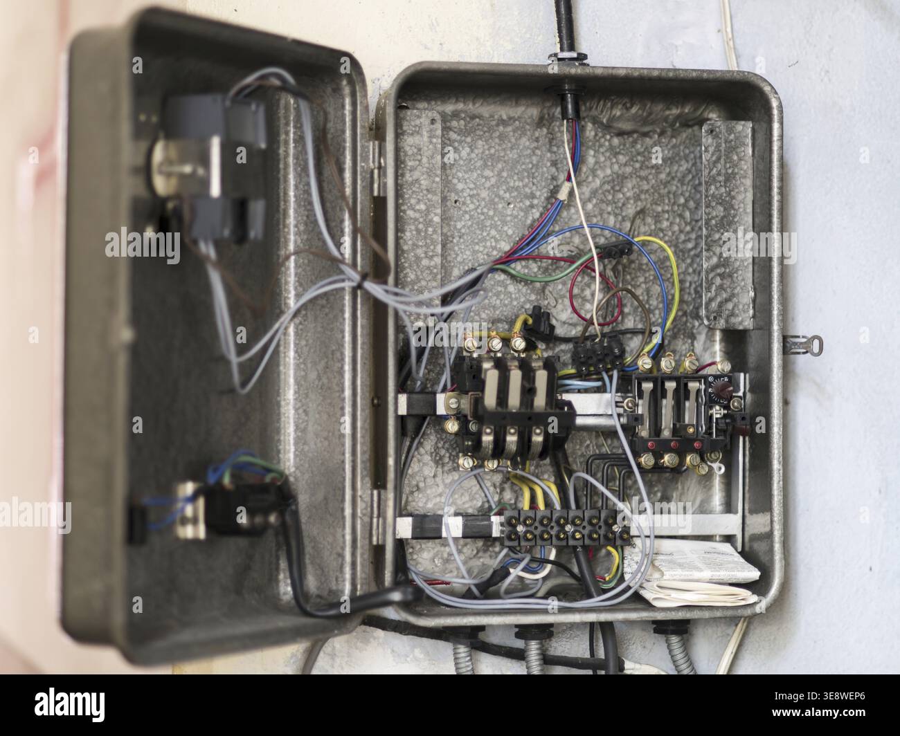 An old broken electrical panel Stock Photo