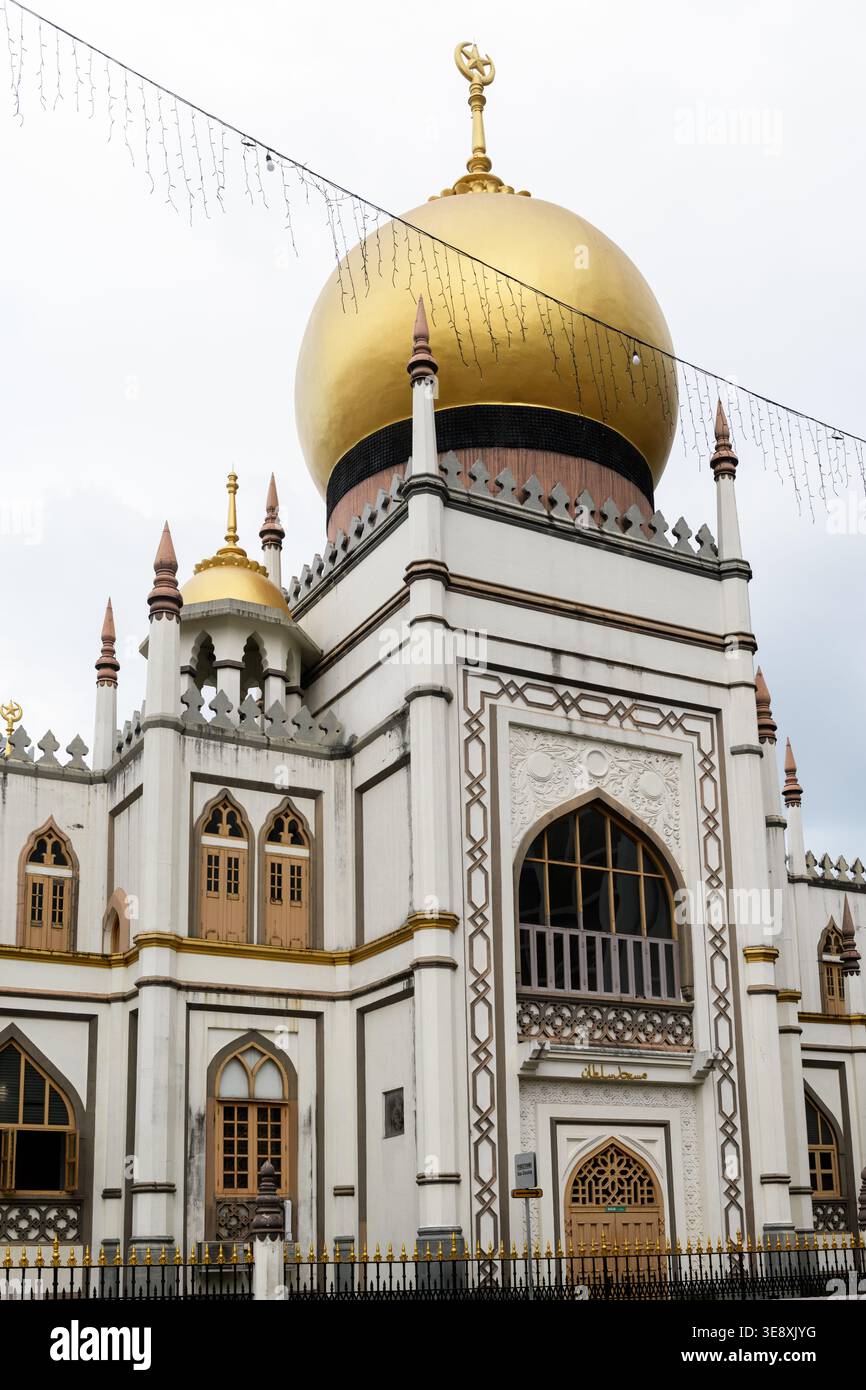 The main facade and golden dome of the Sultan Mosque, an historic religious landmark located within the Kampong Glam locality of Rochor, Singapore. Stock Photo