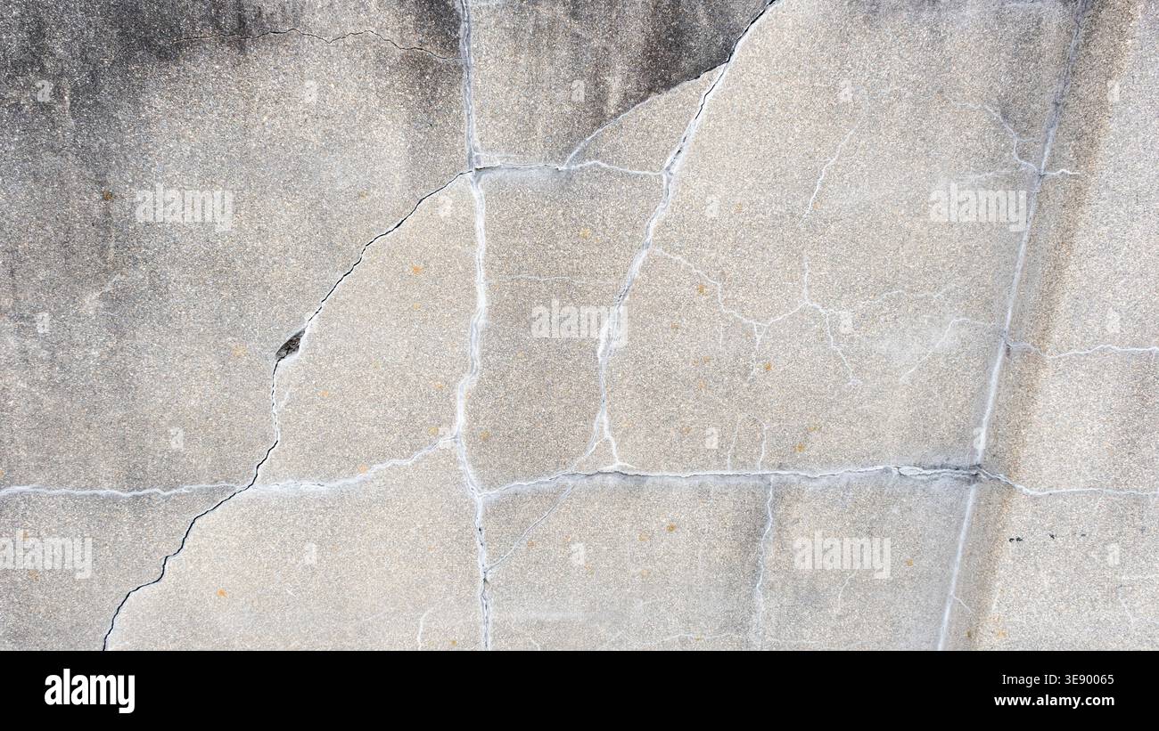 Gray stone wall with cracks, stone background Stock Photo