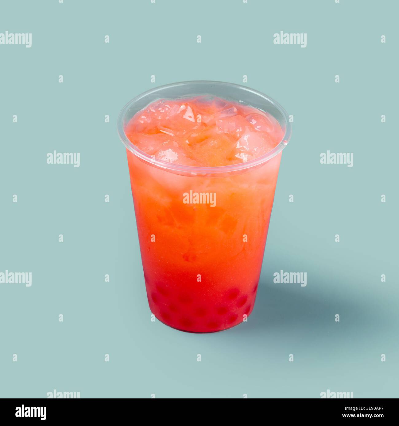 Fruit drink with ice in plastic cup Stock Photo