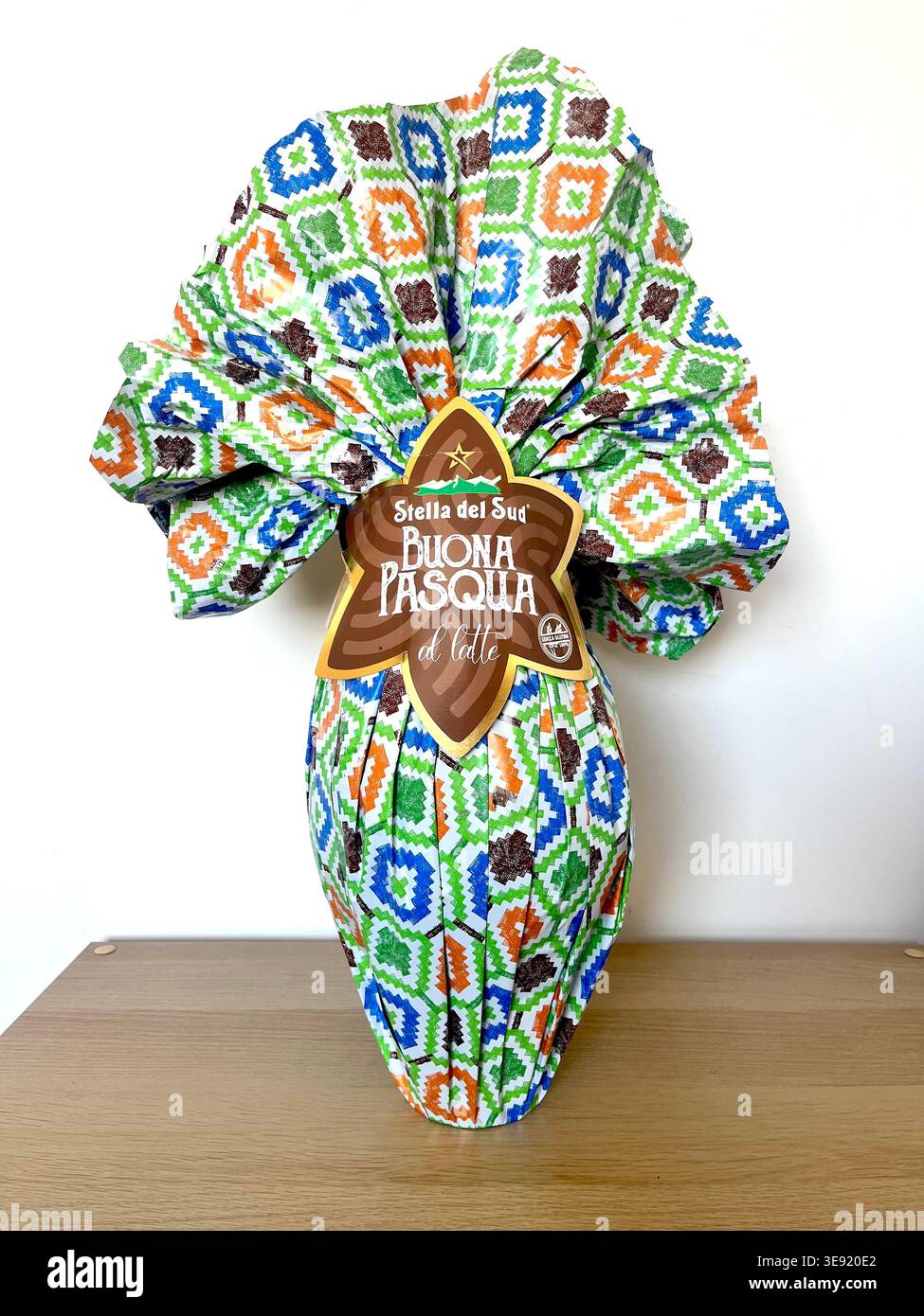 Giant Easter chocolate egg wrapped in traditional packaging by Stella Del Sud, Italian traditional sweet product Stock Photo