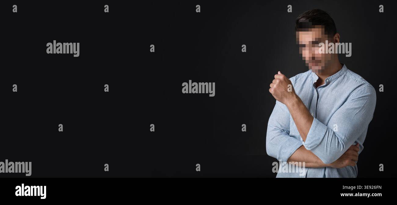 Anonymous man with pixelated face on black background Stock Photo