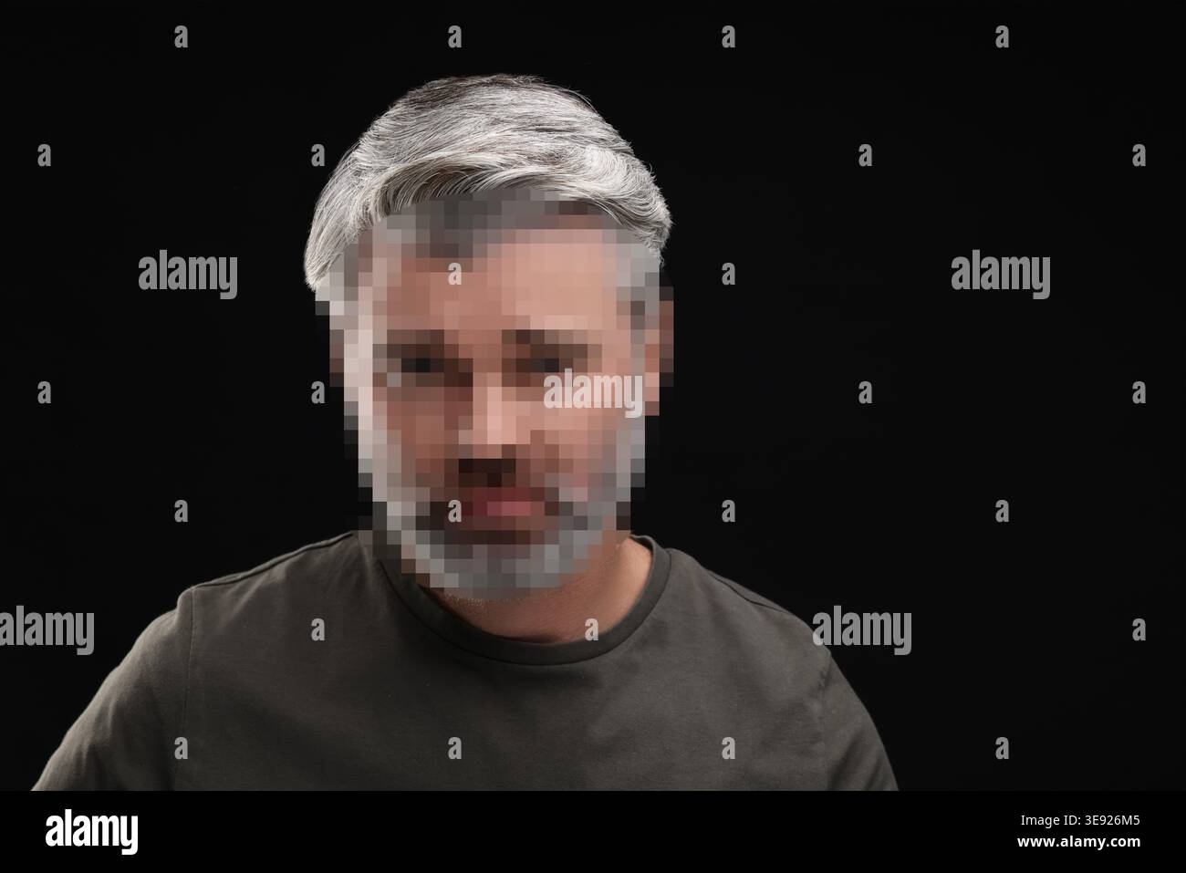 Anonymous man with pixelated face on black background Stock Photo