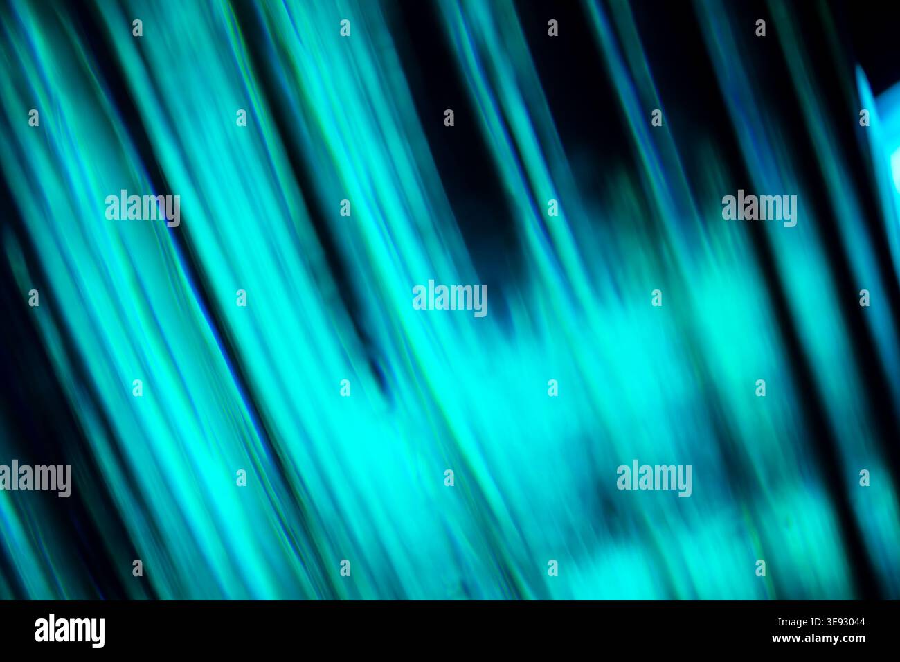 Abstract diagonal bright cyan glowing neon lines with speed motion blur Stock Photo