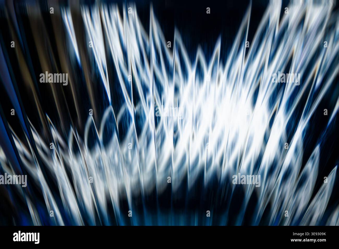 Dynamic abstract blue and white light bursts with geometric jagged patterns Stock Photo