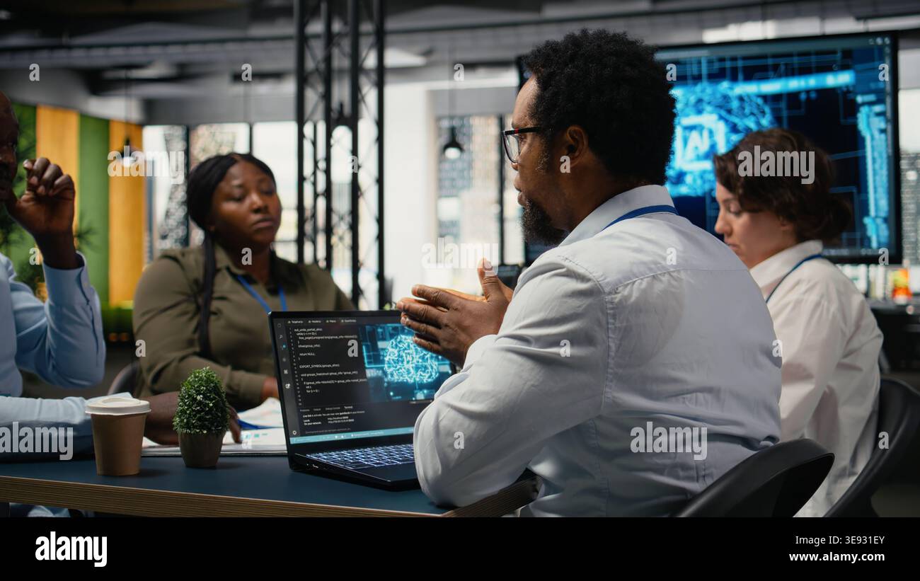 System administrators working in AI startup training predictive models for language processing tasks. Machine learning tech experts use technical expertise for complex IT requirements, camera A Stock Photo