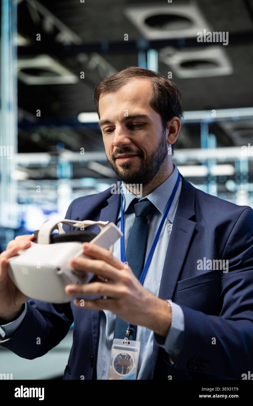 Putting VR goggles on, system performance and smiling programmer in data center. Improving electronics, virtual reality simulation and happy man in server farm implementing optimizations Stock Photo