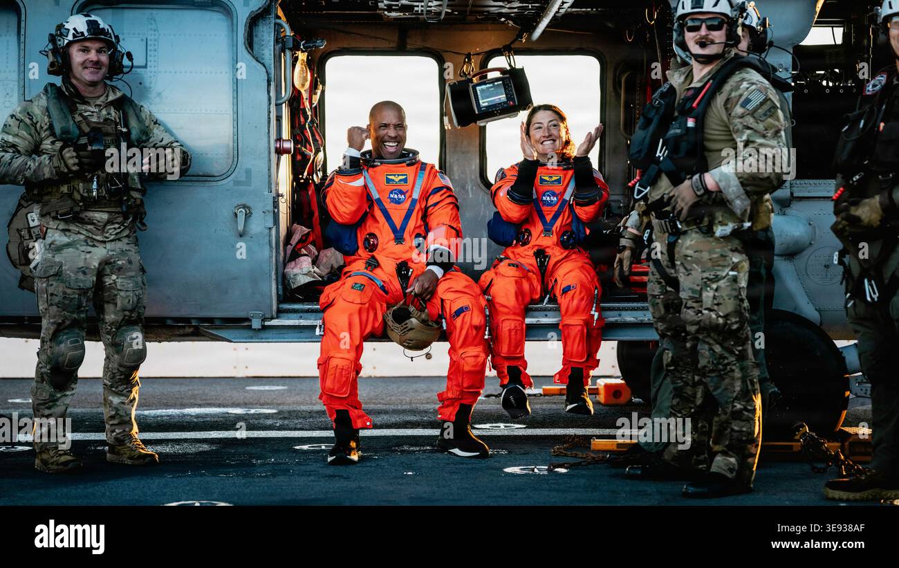 NASA astronauts Victor Glover, left, and Christina Koch sit in an U.S ...