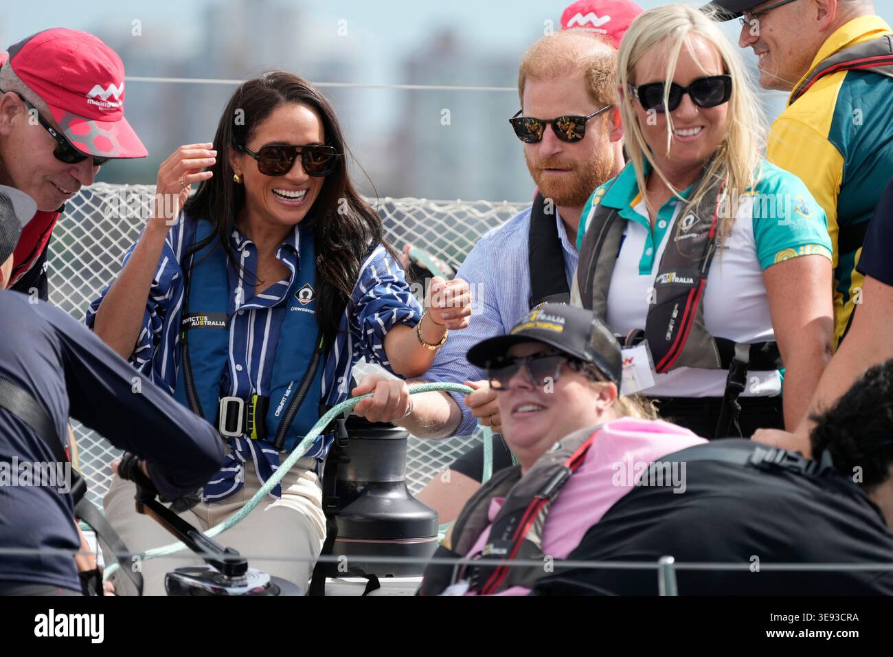 Prince Harry and his wife Meghan, the Duke and Duchess of Sussex help ...