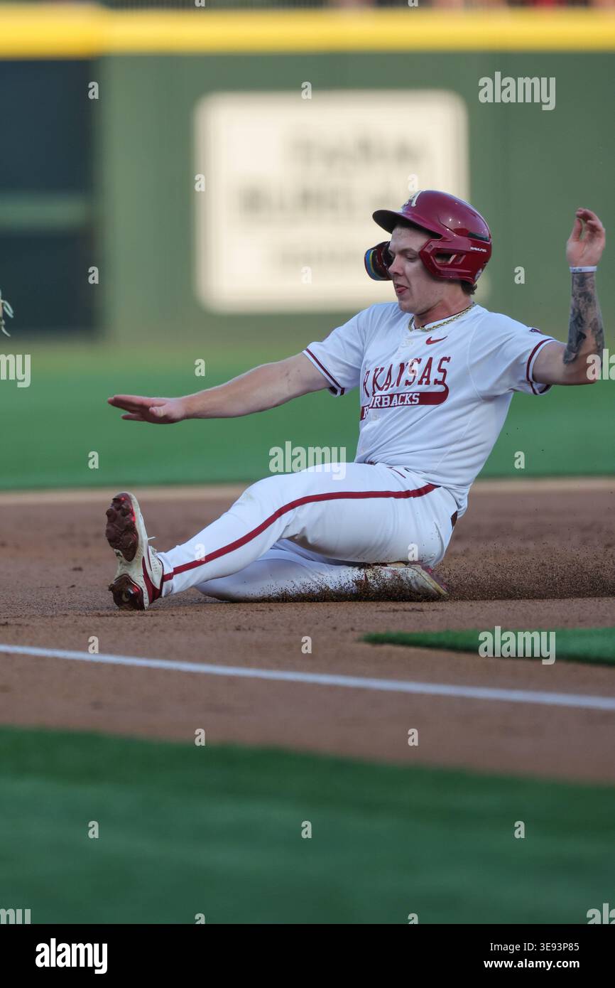 April 16, 2026: Razorback base runner Carter Rutenbar (12) begins his ...
