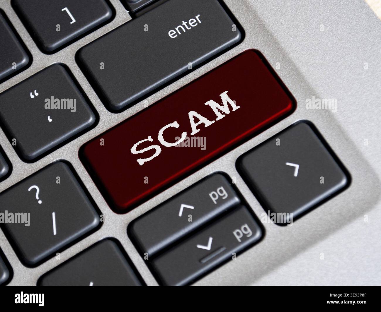 Scam text on red color keyboard. Online security concept Stock Photo