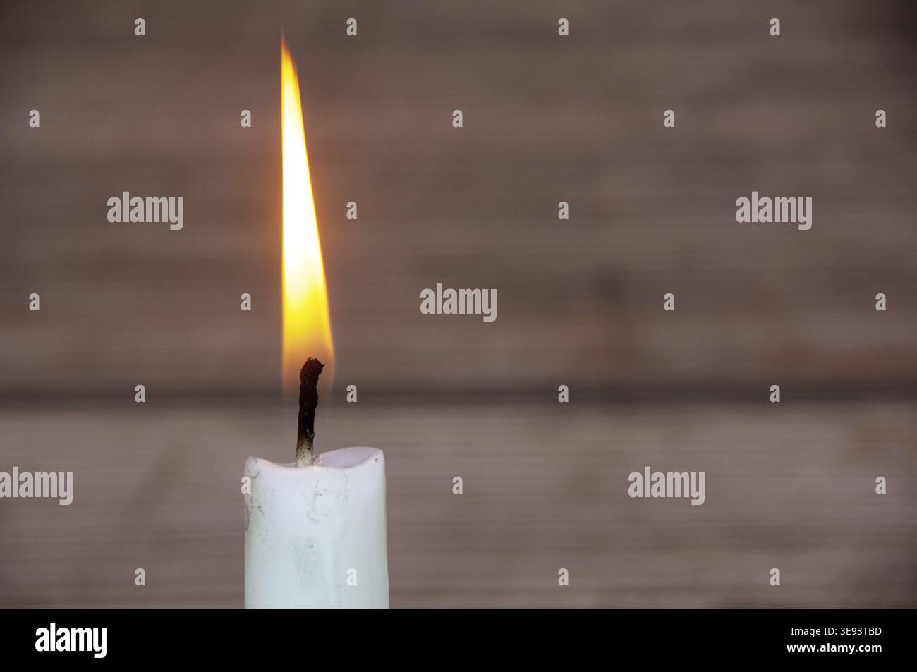 Candle light burning brightly with customizable space for text or ideas. Copy space Stock Photo