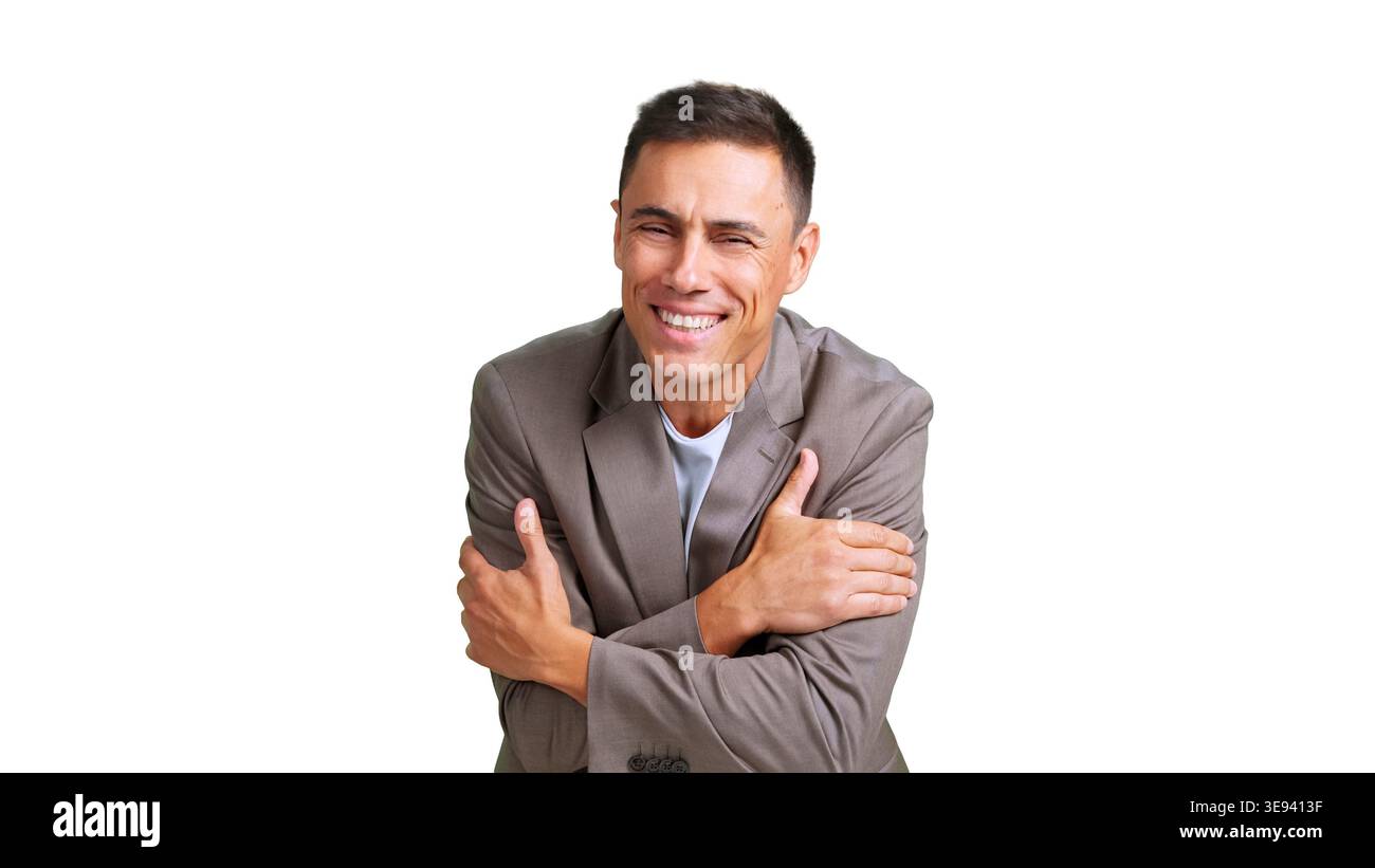 Smiling man hugging himself feeling comfort and happiness Stock Photo