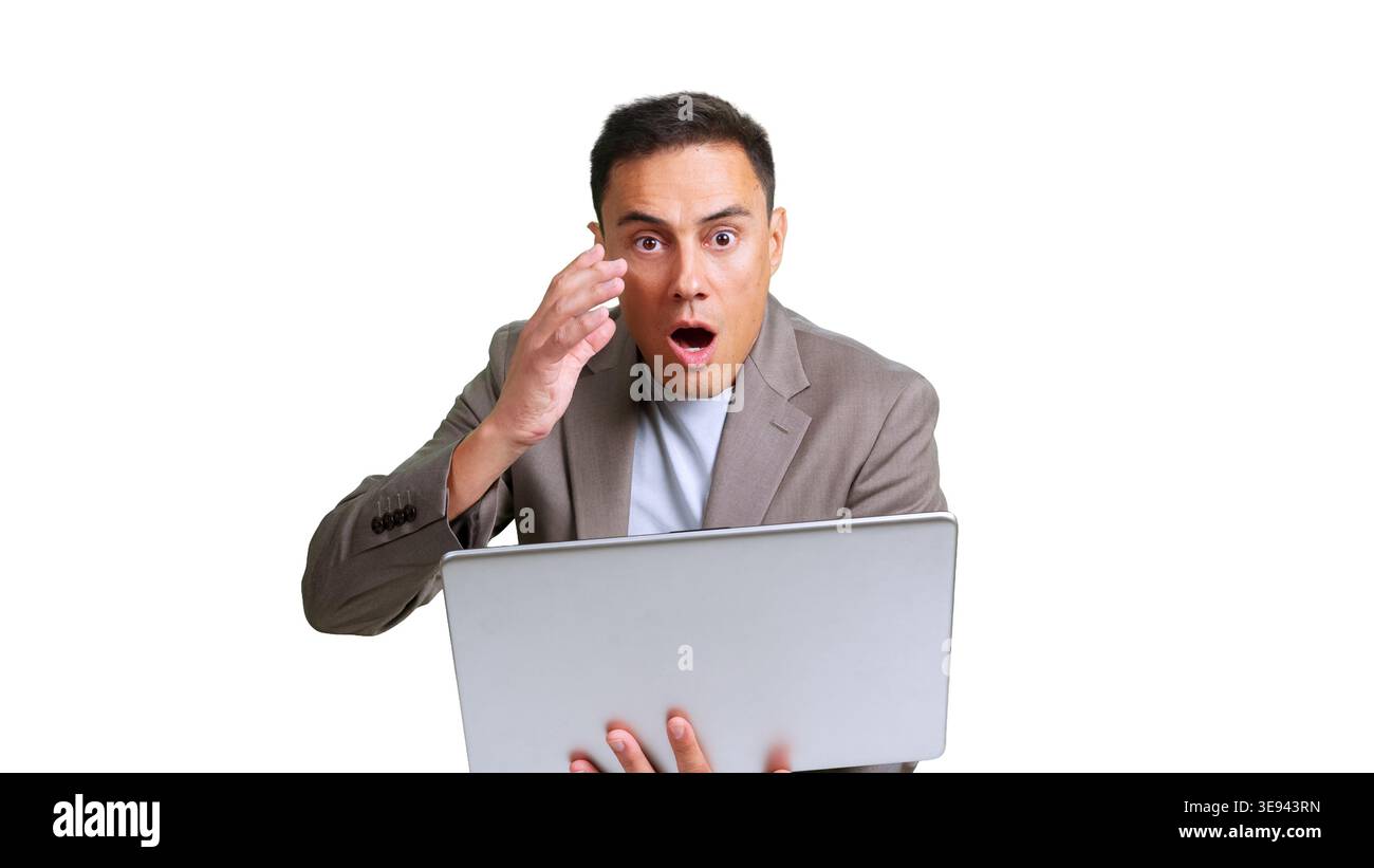 Businessman reacting with shock while using laptop Stock Photo