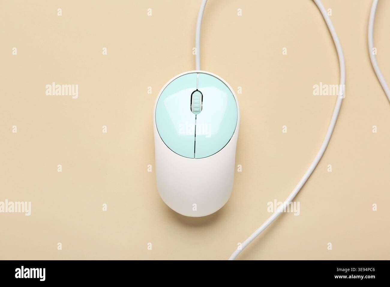 Modern computer mouse on beige background Stock Photo