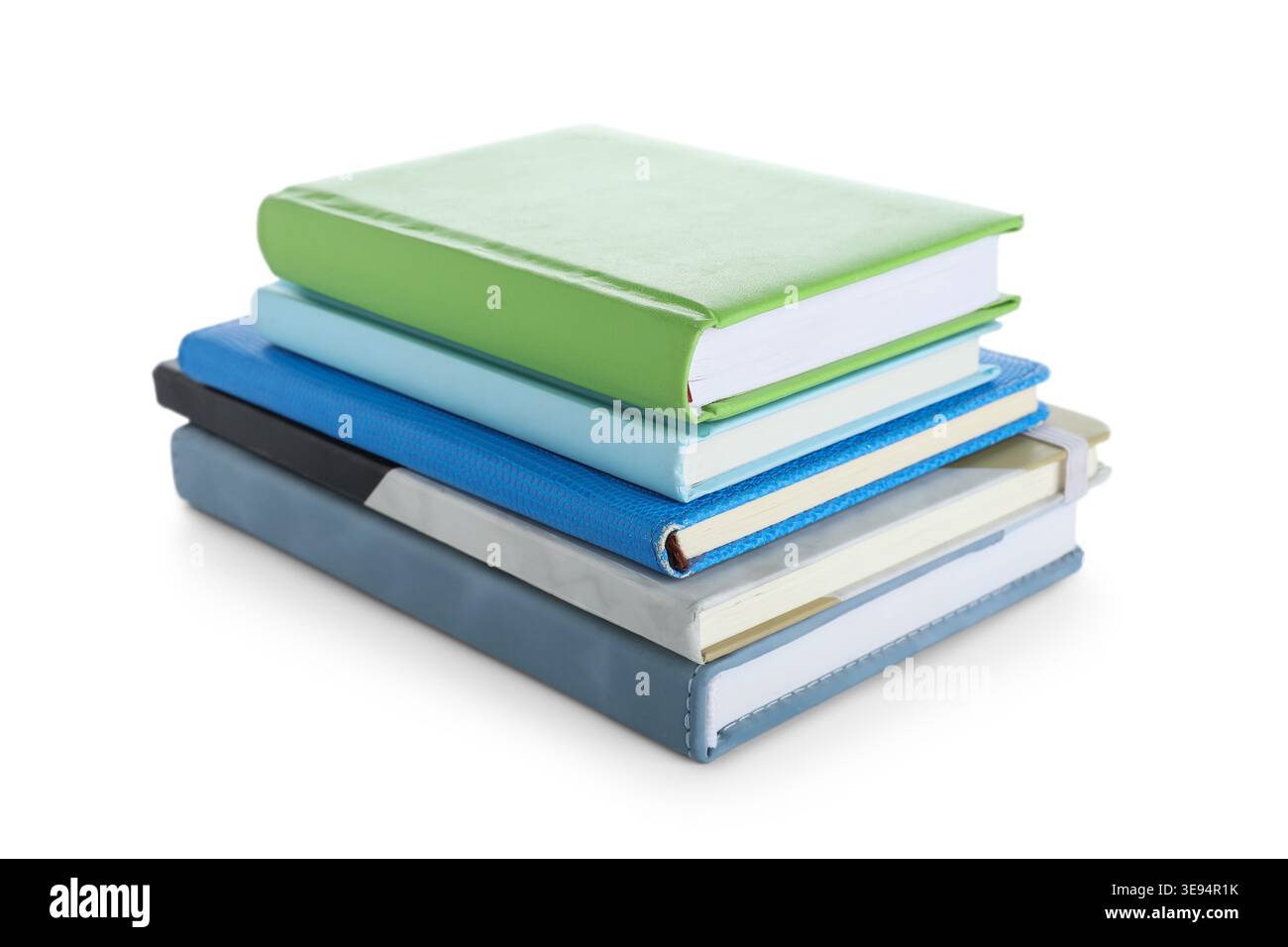 Stack of many different notebooks isolated on white background Stock Photo