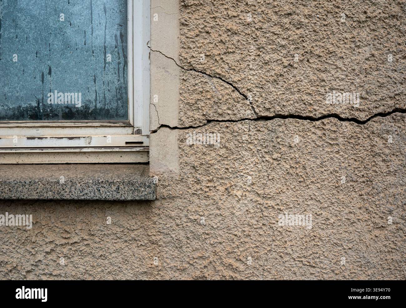 Large crack in a house wall Stock Photo