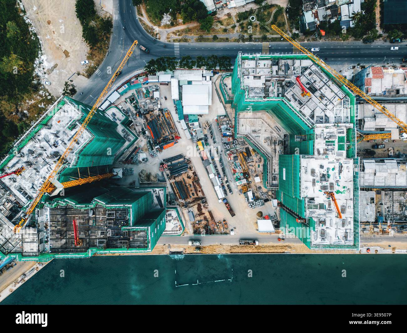 construction site with cranes and high-rise buildings under development ...