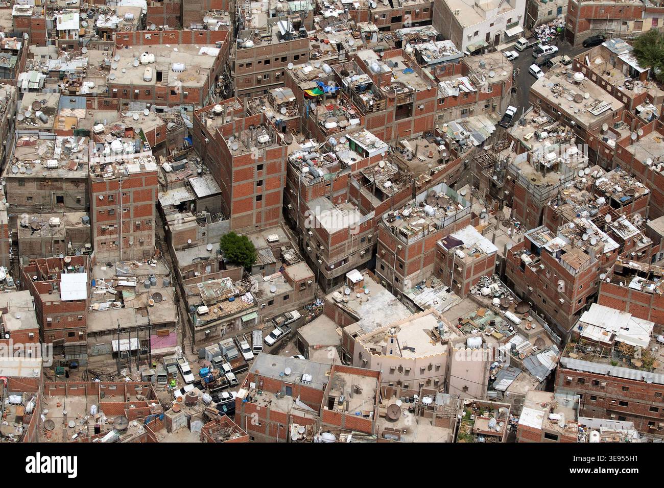 Aerial view of densely packed urban buildings with numerous rooftop ...