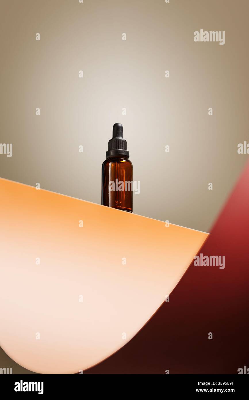 Amber serum dropper bottle on warm set Stock Photo