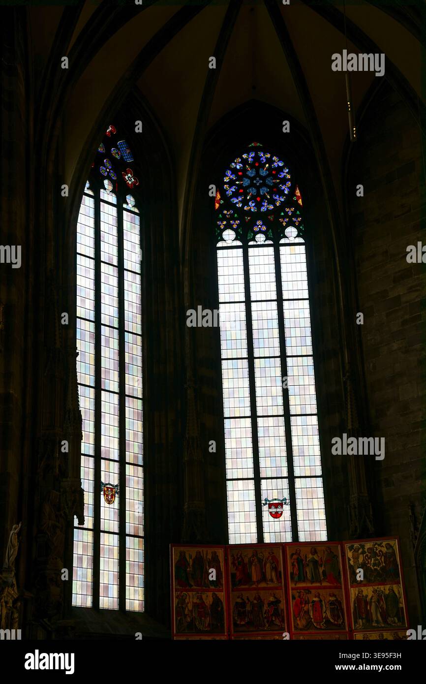 Beneath tall stained glass windows inside hi-res stock photography and ...
