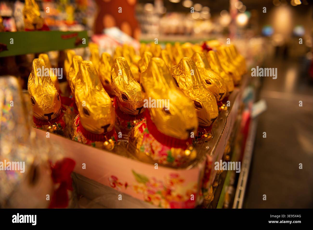 Chocolate bunnies in foil are widely available on the supermarket shelves. Stock Photo