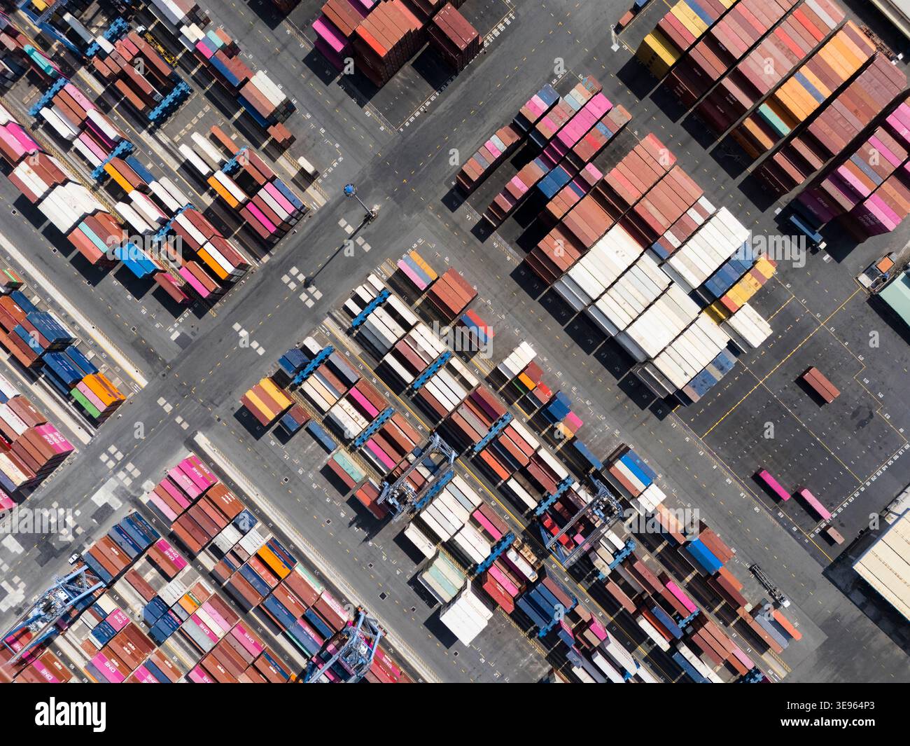 Aerial view of colorful shipping containers packed tightly in a port ...