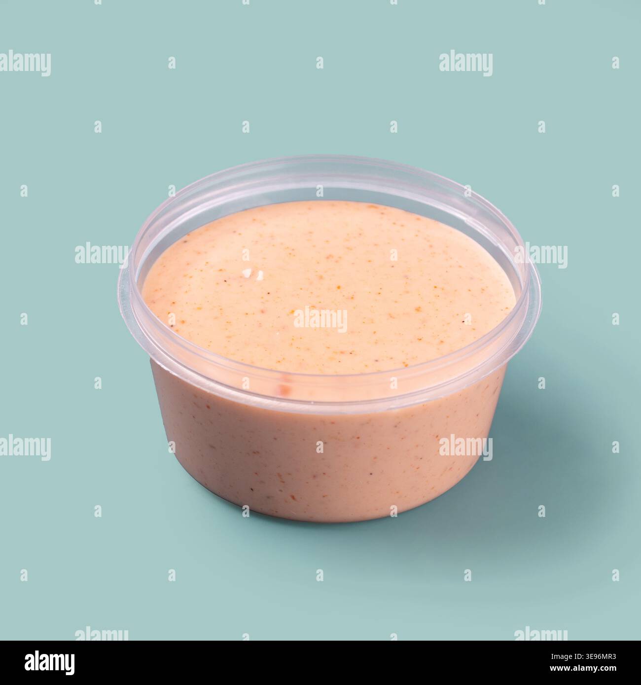 Creamy pink sauce in plastic container Stock Photo