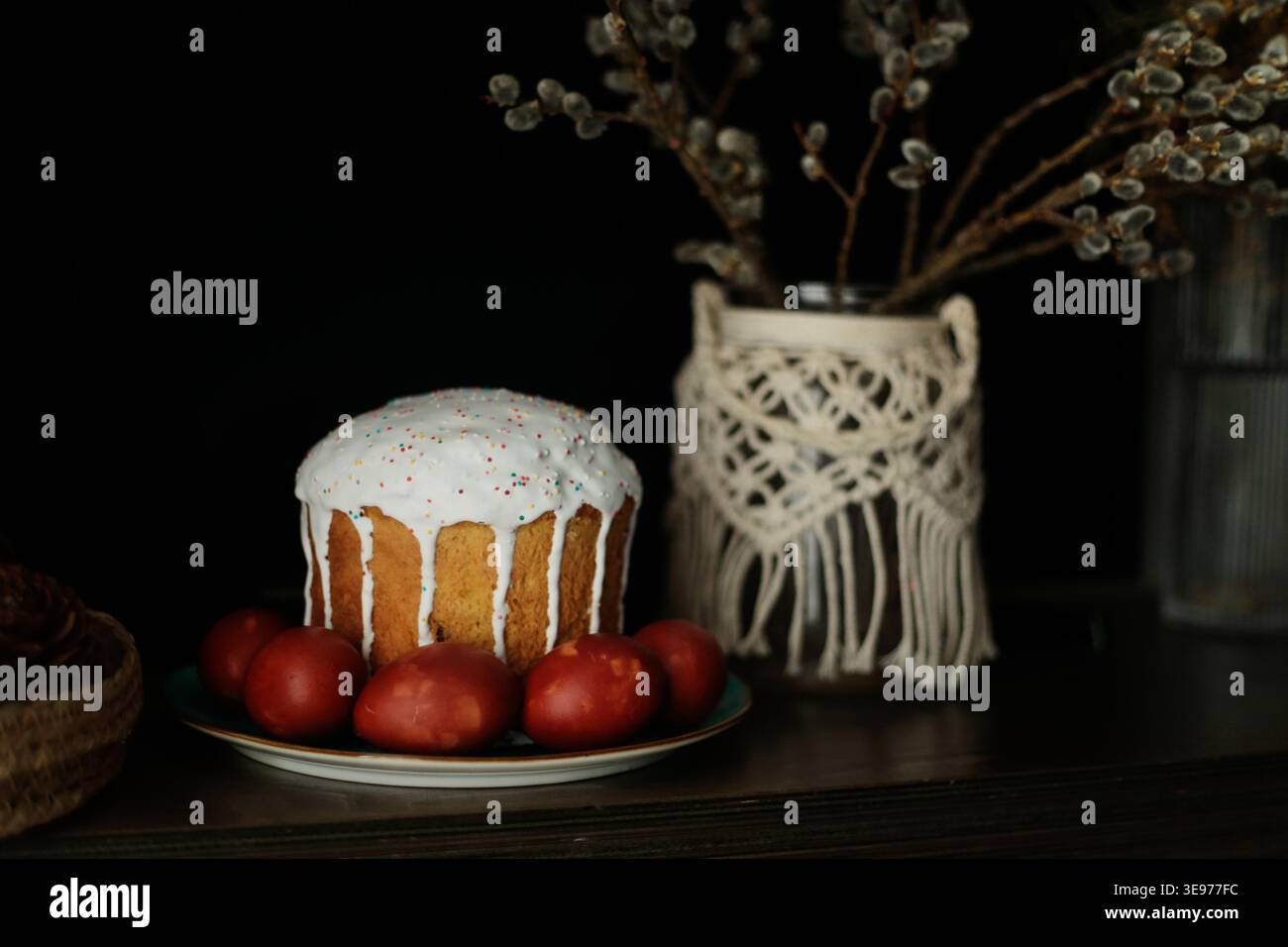 Traditional Easter cake with icing and red eggs Stock Photo