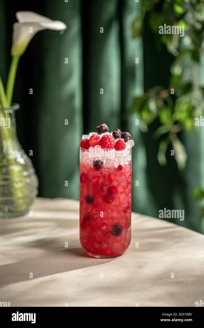 Berry cocktail with ice and fresh mixed berries Stock Photo