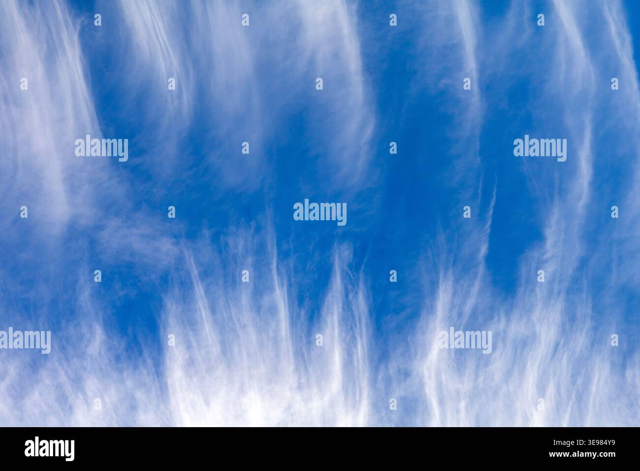 High altitude cirrus cloud formations with wispy feather streaks sky Stock Photo