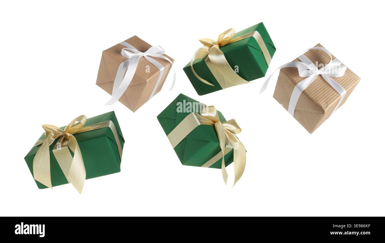 Gift boxes flying in air against white background Stock Photo