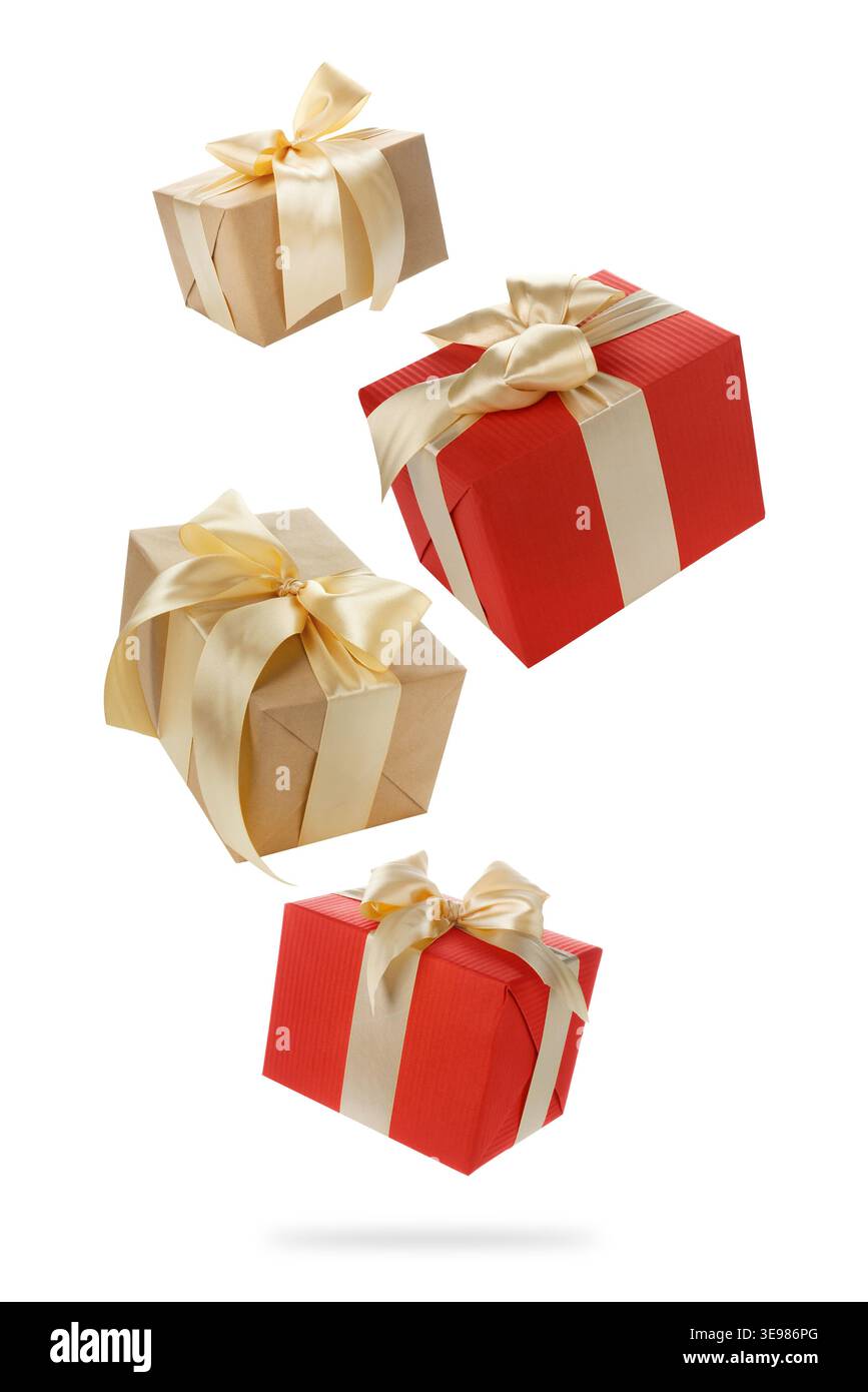 Gift boxes flying in air against white background Stock Photo