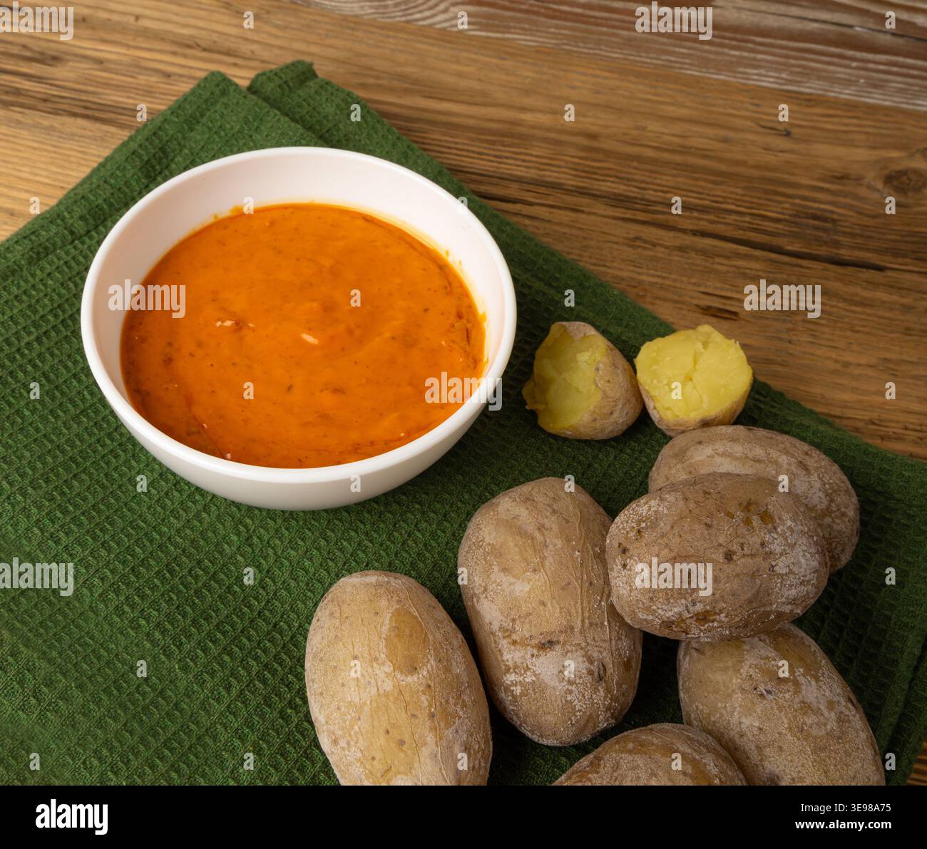 Red mojo rojo and green mojo verde sauces, traditional Tenerife dips, mojo picon dressing, Canary Islands Papas arrugadas sea water boiled potatoes, S Stock Photo