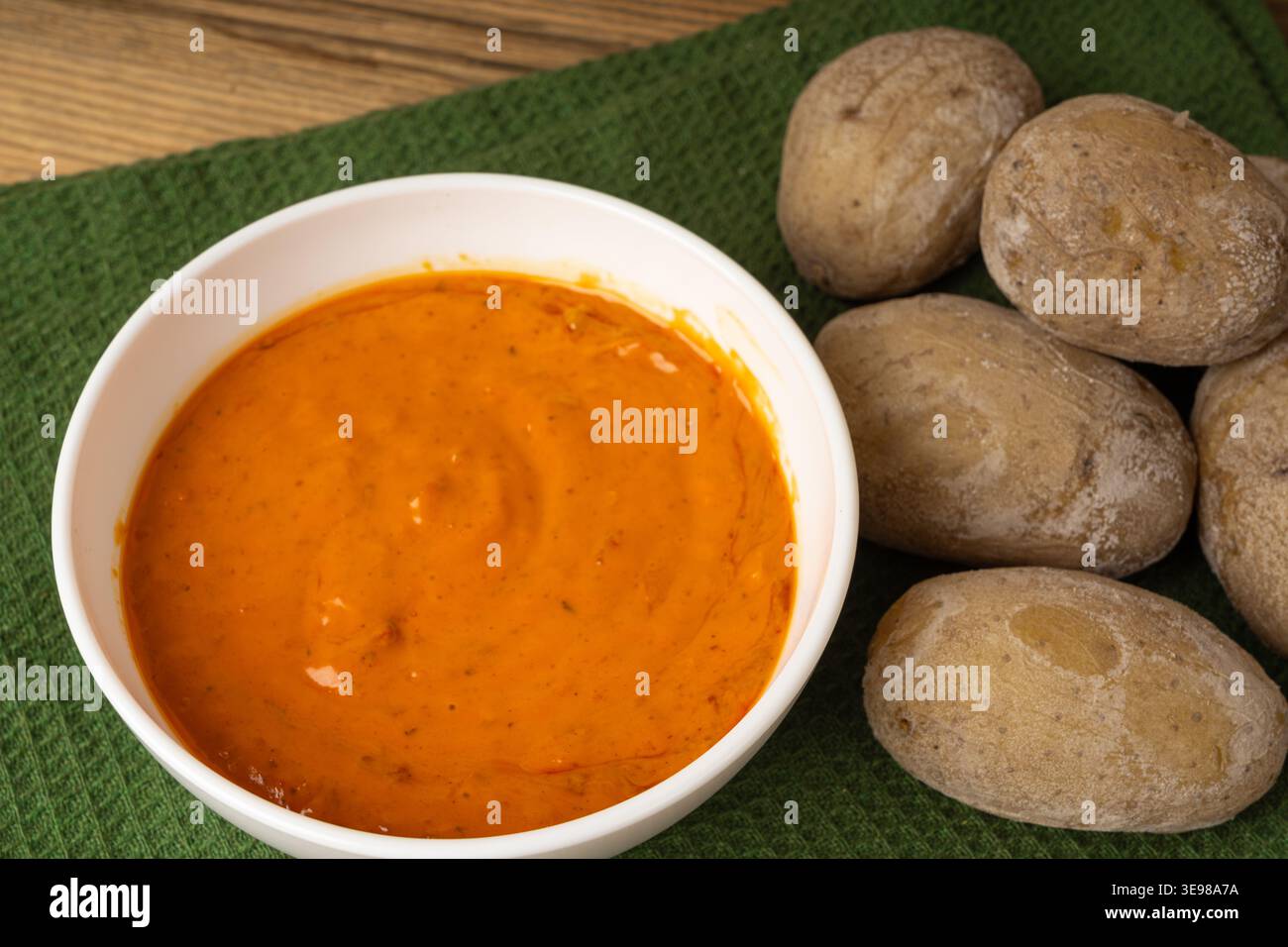 Red mojo rojo and green mojo verde sauces, traditional Tenerife dips, mojo picon dressing, Canary Islands Papas arrugadas sea water boiled potatoes, S Stock Photo