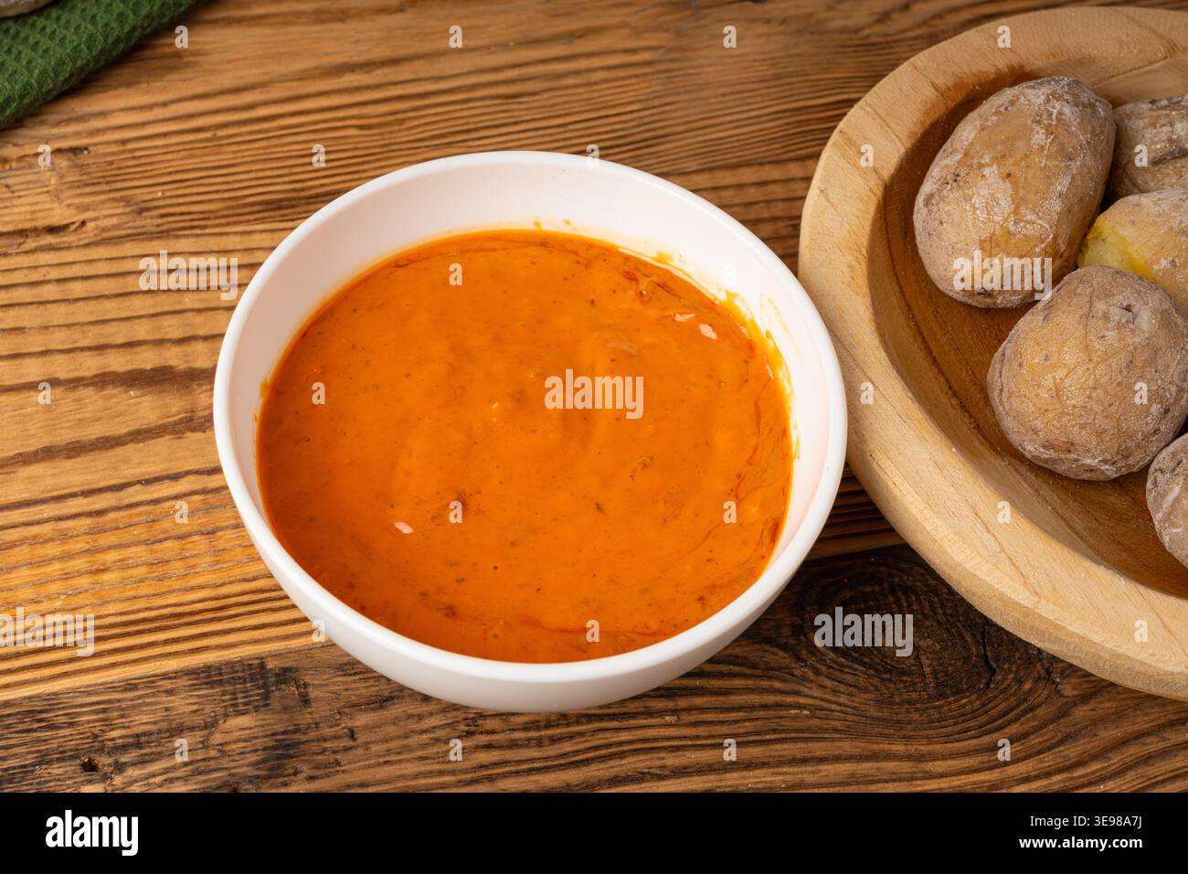 Red mojo rojo and green mojo verde sauces, traditional Tenerife dips, mojo picon dressing, Canary Islands Papas arrugadas sea water boiled potatoes, S Stock Photo