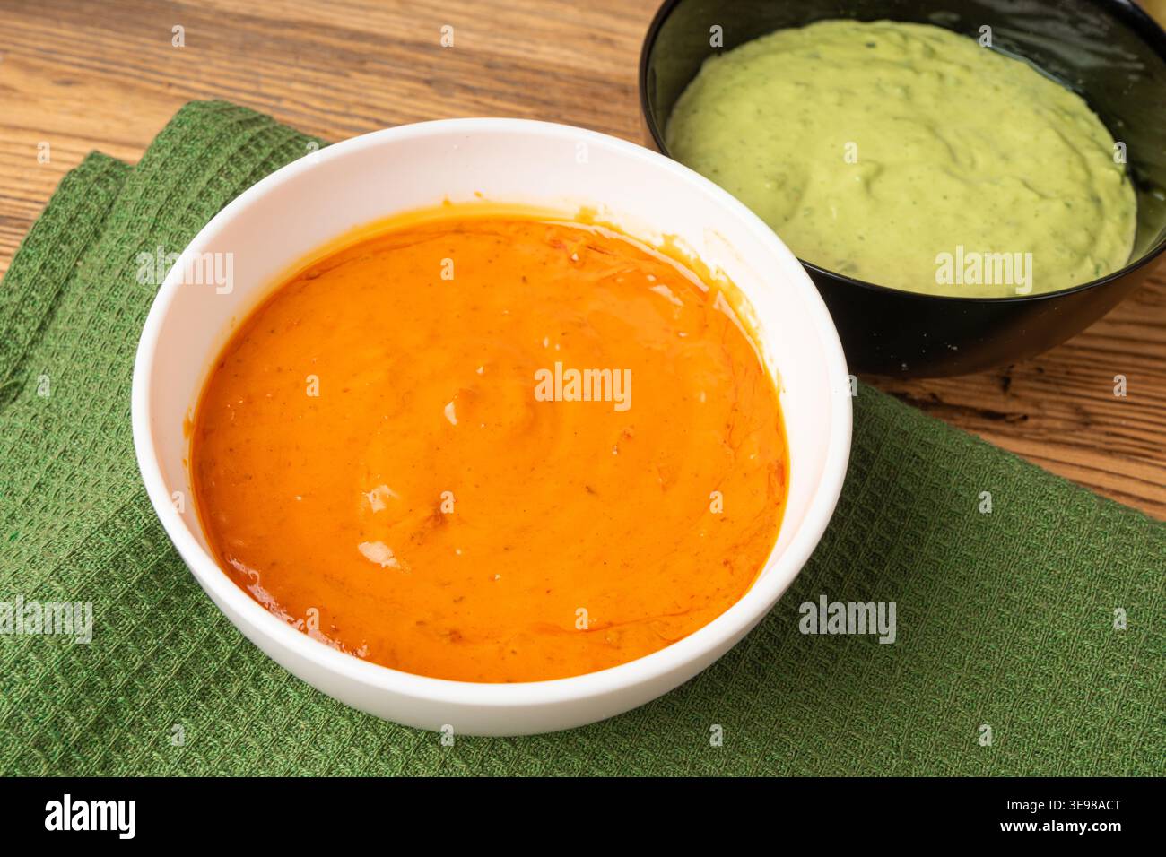 Red mojo rojo and green mojo verde sauces, traditional Tenerife dips, mojo picon dressing, Canary Islands Papas arrugadas sea water boiled potatoes, S Stock Photo