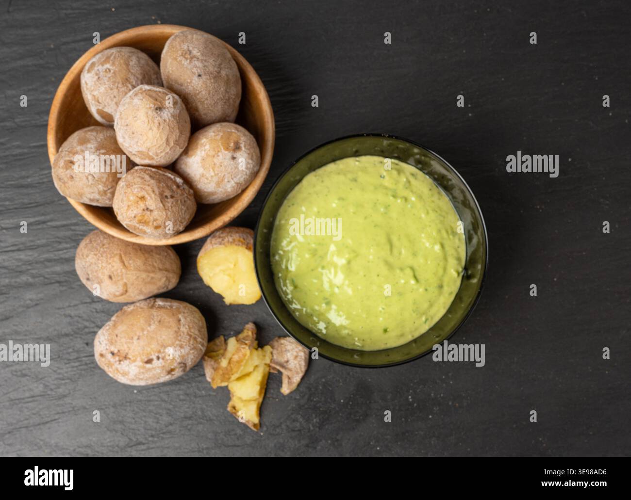 Red mojo rojo and green mojo verde sauces, traditional Tenerife dips, mojo picon dressing, Canary Islands Papas arrugadas sea water boiled potatoes, S Stock Photo