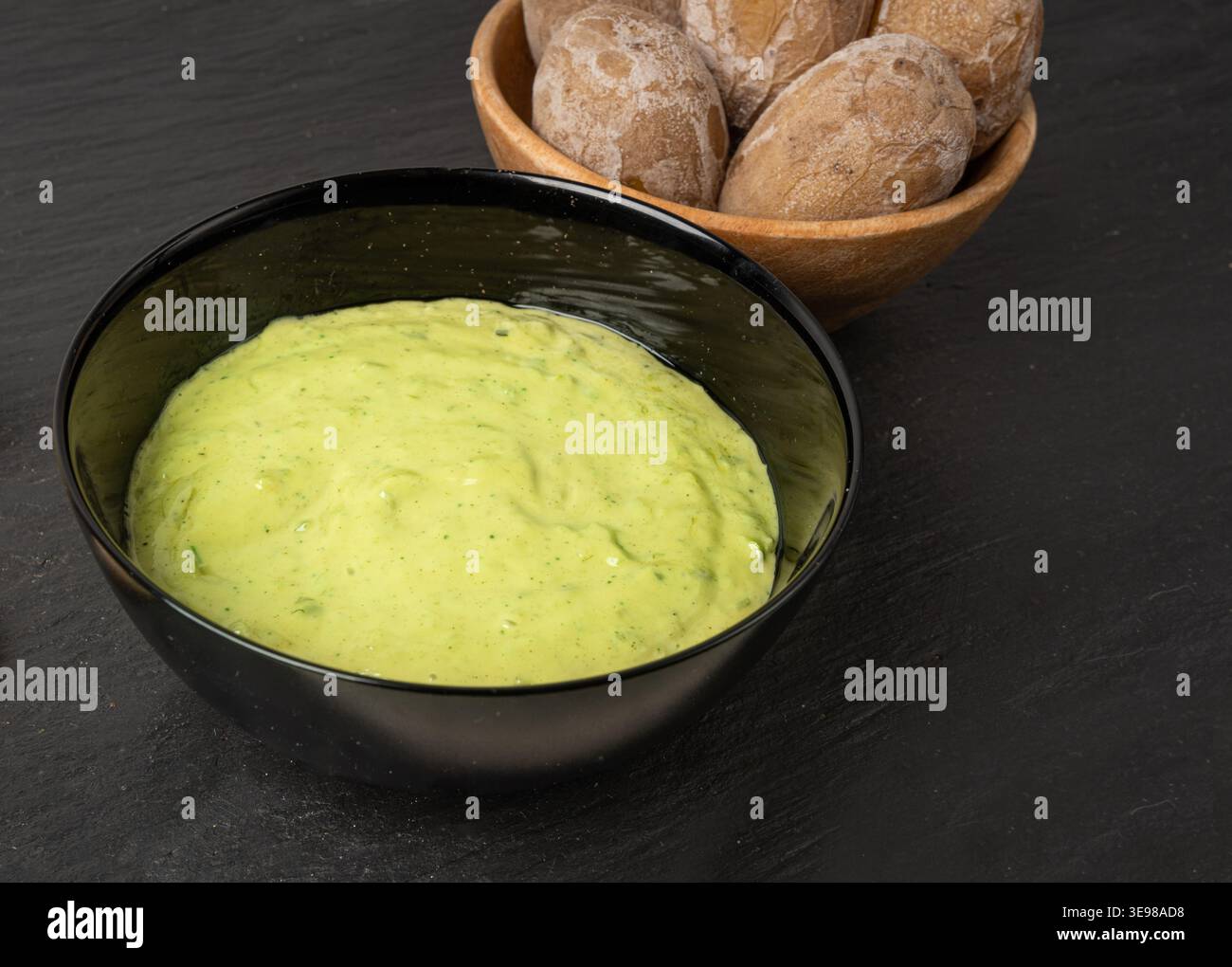 Red mojo rojo and green mojo verde sauces, traditional Tenerife dips, mojo picon dressing, Canary Islands Papas arrugadas sea water boiled potatoes, S Stock Photo