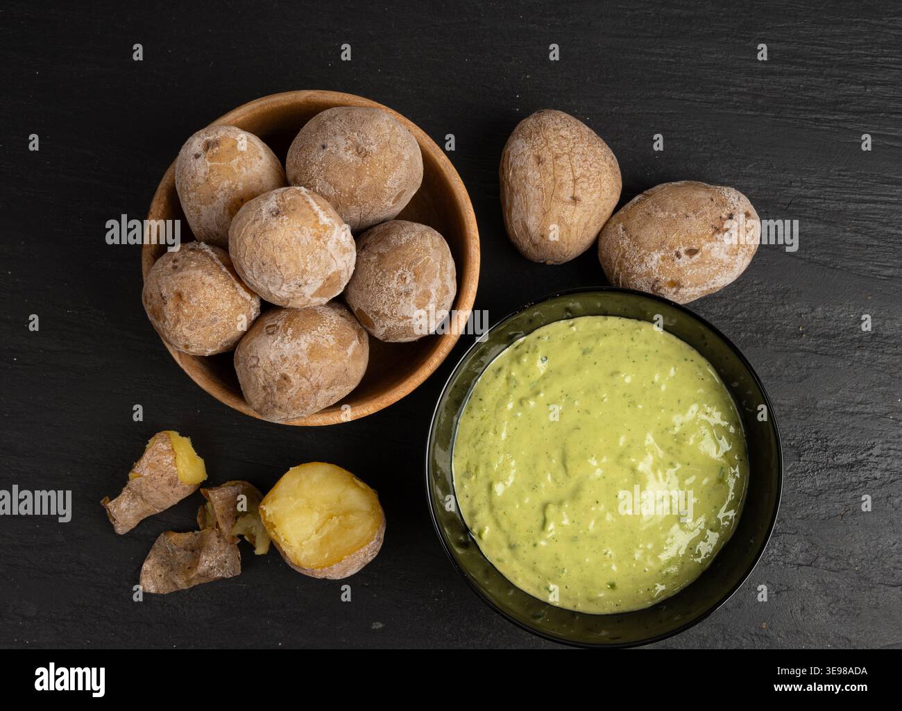 Red mojo rojo and green mojo verde sauces, traditional Tenerife dips, mojo picon dressing, Canary Islands Papas arrugadas sea water boiled potatoes, S Stock Photo