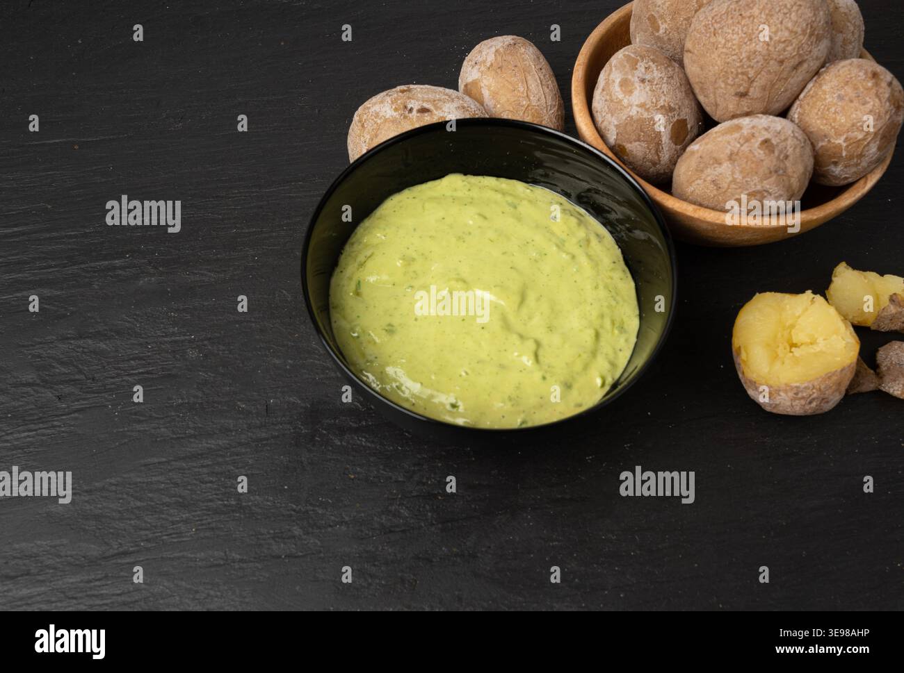 Red mojo rojo and green mojo verde sauces, traditional Tenerife dips, mojo picon dressing, Canary Islands Papas arrugadas sea water boiled potatoes, S Stock Photo