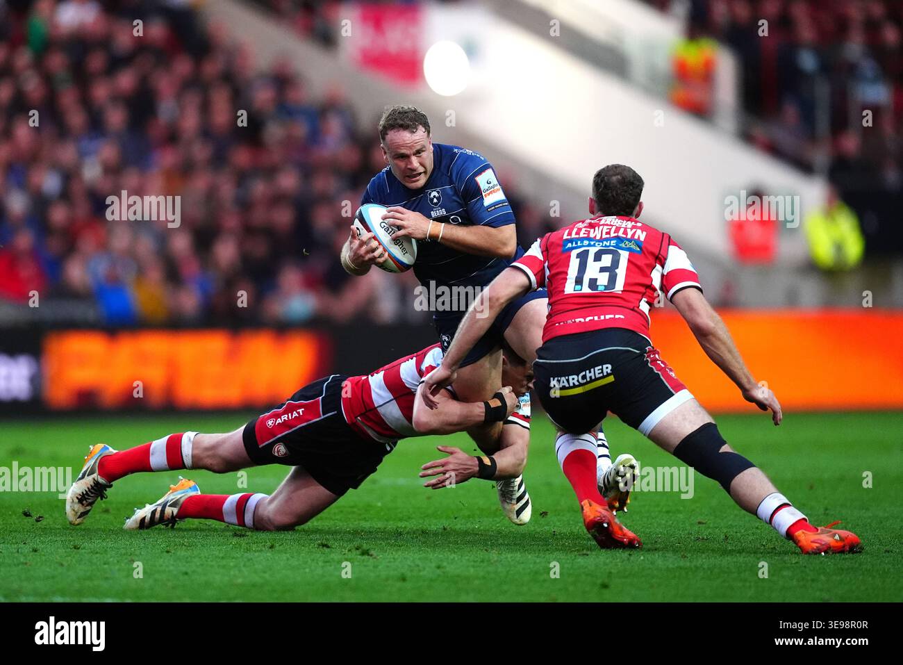 Bristol Bears' James Williams (centre) is tackled by Gloucester Rugby's ...