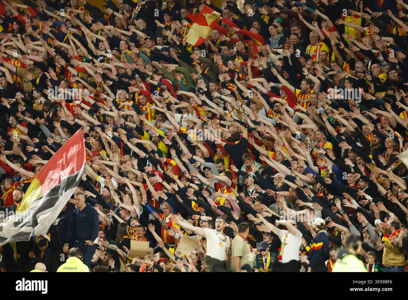 Lens fans celebrate after a League One soccer match between Lens and ...