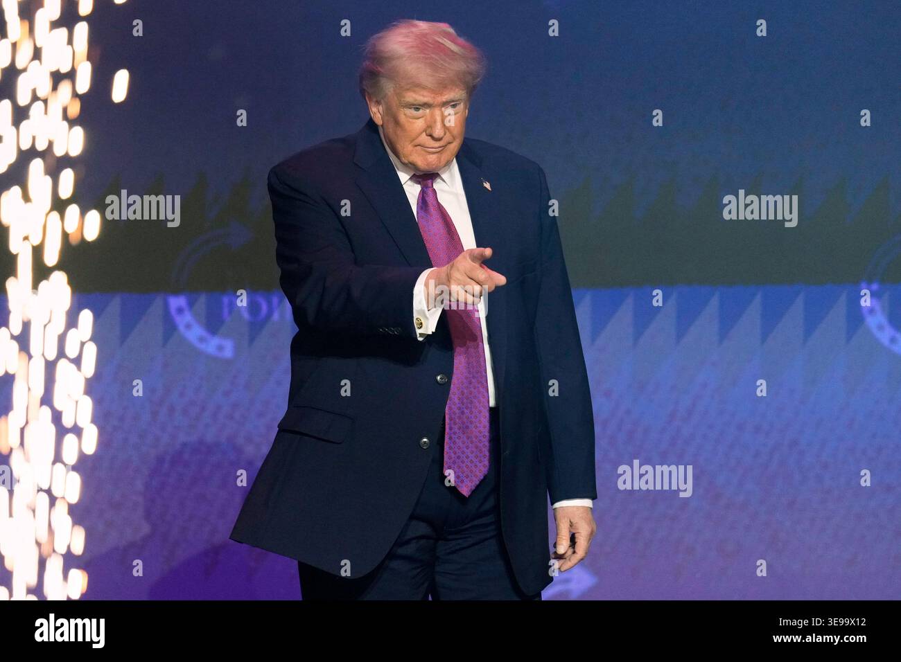 President Donald Trump takes the stage at a Turning Point USA event ...